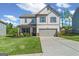 Charming two-story home with well-manicured lawn, inviting curb appeal, and attached two-car garage at 150 Ivy Chase Loop, Dallas, GA 30157