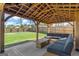 Outdoor patio featuring a large seating area, fire pit, and spacious, fenced backyard at 150 Ivy Chase Loop, Dallas, GA 30157