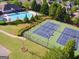Aerial view of a community tennis court with manicured landscaping at 150 Ivy Chase Loop, Dallas, GA 30157