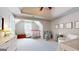 bedroom with trey ceiling, play area, and an abundance of natural light at 30 Saint Charles Pl, Sharpsburg, GA 30277
