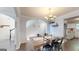 Charming dining room featuring modern table setting, hardwood floors, and stylish decor at 30 Saint Charles Pl, Sharpsburg, GA 30277