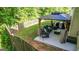 Relaxing backyard gazebo featuring comfortable seating, string lights, and a well-maintained privacy fence at 30 Saint Charles Pl, Sharpsburg, GA 30277