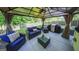 Inviting gazebo featuring comfortable seating, outdoor lighting, and a built-in grill for outdoor entertaining at 30 Saint Charles Pl, Sharpsburg, GA 30277