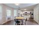 Well-lit kitchen with stainless steel appliances and a cozy breakfast nook near the patio door at 30 Saint Charles Pl, Sharpsburg, GA 30277