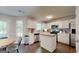 Well-lit kitchen featuring white cabinets, stainless steel appliances, and a butcher block island at 30 Saint Charles Pl, Sharpsburg, GA 30277