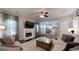 Comfortable living room featuring a fireplace, neutral-toned furniture, and an open view to the kitchen at 30 Saint Charles Pl, Sharpsburg, GA 30277