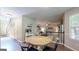 Open-concept living area showing a staircase and the adjacent living area with a coffee station at 30 Saint Charles Pl, Sharpsburg, GA 30277