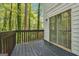 Cozy outdoor deck offers views of lush greenery and a sliding glass door entry at 4448 Janice Dr, Snellville, GA 30039