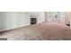 Large living room features neutral walls, carpet, fireplace and two large windows for ample light at 4448 Janice Dr, Snellville, GA 30039