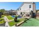 Beautiful backyard with a swimming pool, well maintained artificial turf, and patio at 65 Hill Top Cir, Grantville, GA 30220