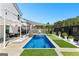 Modern backyard featuring a swimming pool, lounging area, turf, and pergola at 65 Hill Top Cir, Grantville, GA 30220