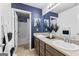 Well-lit bathroom features double vanity, large mirror, and stylish decor at 65 Hill Top Cir, Grantville, GA 30220