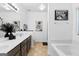 Bright bathroom features double vanity, tub and shower combination, and modern decor at 65 Hill Top Cir, Grantville, GA 30220
