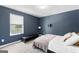 Cozy bedroom with large window and neutral carpet, featuring a minimalist design at 65 Hill Top Cir, Grantville, GA 30220