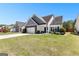 Charming two-story home boasts a manicured lawn, gray accents, and a welcoming entrance at 65 Hill Top Cir, Grantville, GA 30220