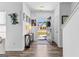 Bright foyer features wood-look floors, decorative lighting, console table, and an open doorway at 65 Hill Top Cir, Grantville, GA 30220