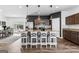 Modern kitchen with granite countertops, stainless steel appliances, and an island with bar seating at 65 Hill Top Cir, Grantville, GA 30220