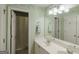 Charming bathroom featuring white double sinks, natural light, and a shower at 1212 Dayspring Trce, Lawrenceville, GA 30045