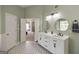 Lovely bathroom featuring a white double sink vanity and modern finishes at 1212 Dayspring Trce, Lawrenceville, GA 30045