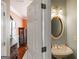 Powder bathroom features an ornate mirror and decorative lighting at 1212 Dayspring Trce, Lawrenceville, GA 30045
