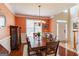 Formal dining room boasts hardwood floors, wainscoting, and a decorative chandelier at 1212 Dayspring Trce, Lawrenceville, GA 30045
