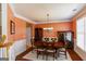 Formal dining room featuring hardwood floors, wainscoting, and a decorative chandelier at 1212 Dayspring Trce, Lawrenceville, GA 30045