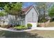 Charming two-story home with light-blue siding, well-manicured landscaping, and an attached two-car garage at 1212 Dayspring Trce, Lawrenceville, GA 30045