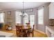 Kitchen nook with table and access to backyard at 1212 Dayspring Trce, Lawrenceville, GA 30045