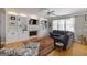 Spacious living room with custom built-ins, fireplace, hardwood floors, and comfortable seating arrangement at 1212 Dayspring Trce, Lawrenceville, GA 30045