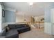 Open loft area with a pullout couch, neutral carpeting, and stairs at 1212 Dayspring Trce, Lawrenceville, GA 30045