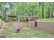 Backyard featuring a swing, flower pot and views of mature trees at 100 Ashland Trl, Tyrone, GA 30290