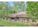 Beautiful backyard with a spacious patio, a pergola, and lush green grass, ideal for outdoor living at 100 Ashland Trl, Tyrone, GA 30290