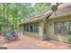 Inviting outdoor patio area, ideal for relaxation and enjoying views of mature trees at 100 Ashland Trl, Tyrone, GA 30290