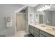 The bathroom boasts a double vanity, a glass-enclosed shower, and modern finishes, creating a spa-like atmosphere at 100 Ashland Trl, Tyrone, GA 30290