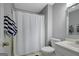 Bathroom with shower featuring curtain, a modern sink, and brushed nickel fixtures at 100 Ashland Trl, Tyrone, GA 30290