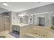This bathroom offers a double vanity, a soaking tub, and a separate shower, providing both convenience and luxury at 100 Ashland Trl, Tyrone, GA 30290