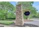 Stone community sign featuring the neighborhood name, surrounded by greenery at 100 Ashland Trl, Tyrone, GA 30290