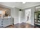 Elegant dining room with hardwood floors and view into the kitchen at 100 Ashland Trl, Tyrone, GA 30290