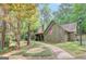 Charming home with stone accents, two-car garage, and a brick walkway leading to the entrance at 100 Ashland Trl, Tyrone, GA 30290
