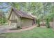Charming home featuring a brick walkway, attached garage, and beautiful landscaping at 100 Ashland Trl, Tyrone, GA 30290