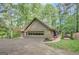 Home exterior showcasing well-manicured lawn, driveway and attached garage at 100 Ashland Trl, Tyrone, GA 30290