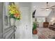 Bright foyer with decorative flower arrangement and doorway leading to the living room at 100 Ashland Trl, Tyrone, GA 30290