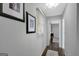 Hallway with hardwood floors, natural light and decorative art at 100 Ashland Trl, Tyrone, GA 30290