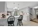 Modern kitchen boasts white cabinets, quartz countertops, and sleek appliances at 100 Ashland Trl, Tyrone, GA 30290