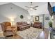 Inviting living room with vaulted ceilings, ceiling fan, and elegant decor at 100 Ashland Trl, Tyrone, GA 30290
