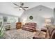 Inviting living room with high ceilings, large windows, and comfortable leather furniture at 100 Ashland Trl, Tyrone, GA 30290