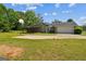 Exterior of a house featuring a backyard and a basketball court with plenty of yard space at 110 Tamarack Trl, Mcdonough, GA 30252