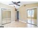 Bedroom features mirrored closets, light-colored walls and wood flooring with a fan in the vaulted ceiling at 110 Tamarack Trl, Mcdonough, GA 30252