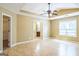 Spacious bedroom with tray ceiling, ceiling fan, and an ensuite bathroom and walk-in closet at 110 Tamarack Trl, Mcdonough, GA 30252