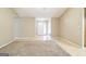 Open-concept living room with hardwood floors and a welcoming front entrance at 110 Tamarack Trl, Mcdonough, GA 30252